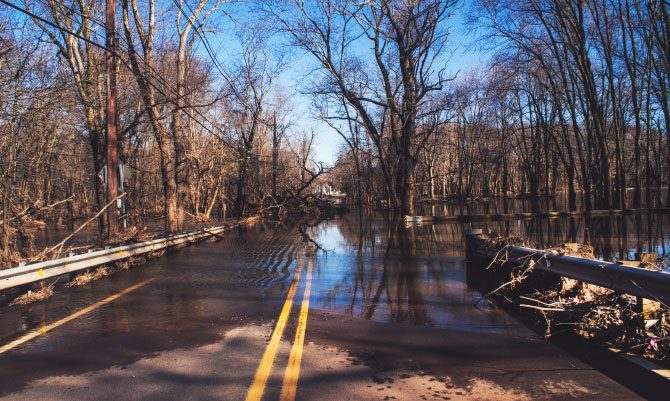 flood water covering a rural road