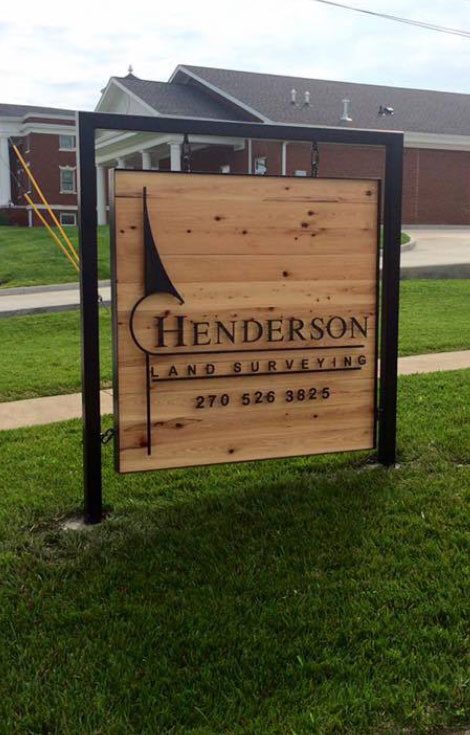 Henderson Land Surveying wood sign